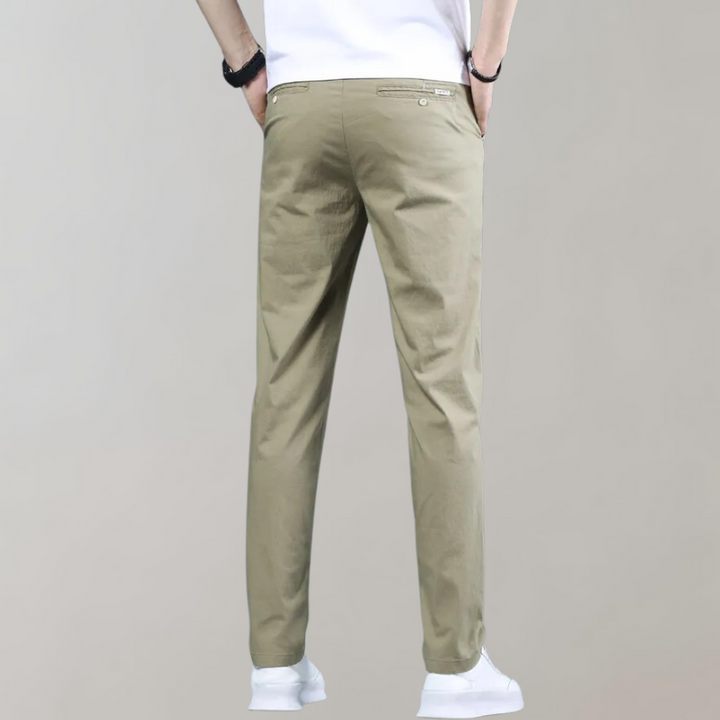 Men's slim-fit casual pants with a visible waistband and belt loops, perfect for versatile everyday styling.