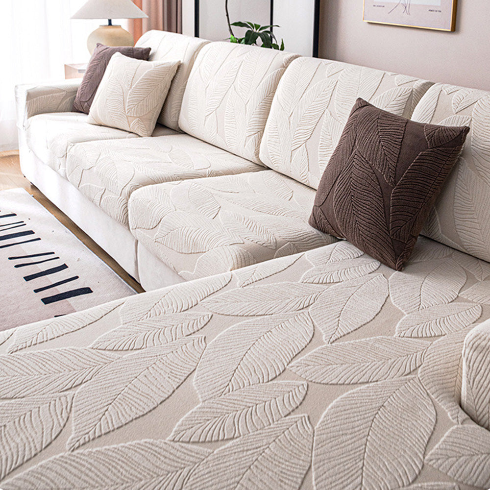 Stylish full wrap sofa cover with subtle leaf pattern. Machine washable, pet friendly & spill resistant home decor.