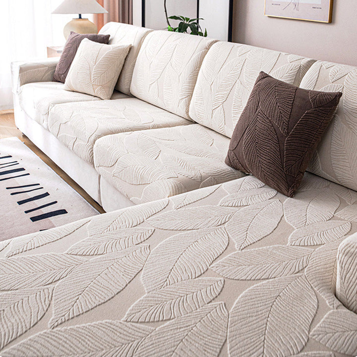 Stylish full wrap sofa cover with subtle leaf pattern. Machine washable, pet friendly & spill resistant home decor.