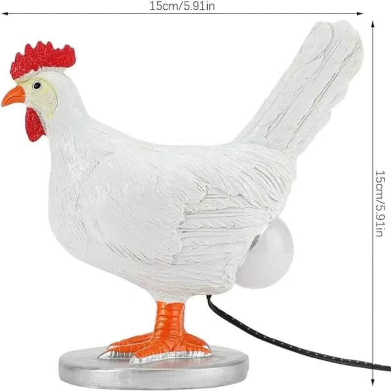 Decorative white chicken LED table lamp with whimsical design. Ideal as a night light, accent light, or home decor.