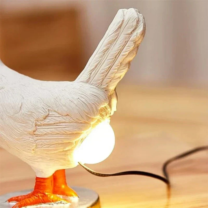 Whimsical white chicken LED table lamp, perfect as a novelty night light or decorative accent for home decor.