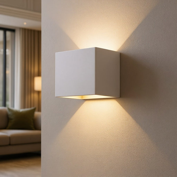 Sleek modern LED wall sconce, a cordless and rechargeable accent light with motion sensor for stylish home decor.