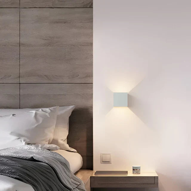 Rechargeable LED wall lamp with motion sensor, providing cordless, energy-saving lighting for both indoor and outdoor use.
