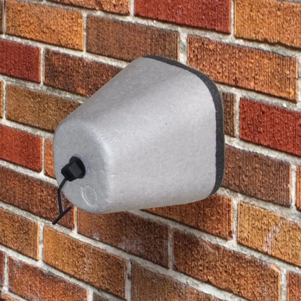 "Gray polystyrene outdoor spigot protector with Velcro strap, providing winter insulation cover for faucets against freeze da