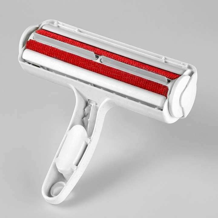 Efficient Pet Fur Remover, a reusable lint roller for quickly cleaning dog and cat hair from furniture & carpets.