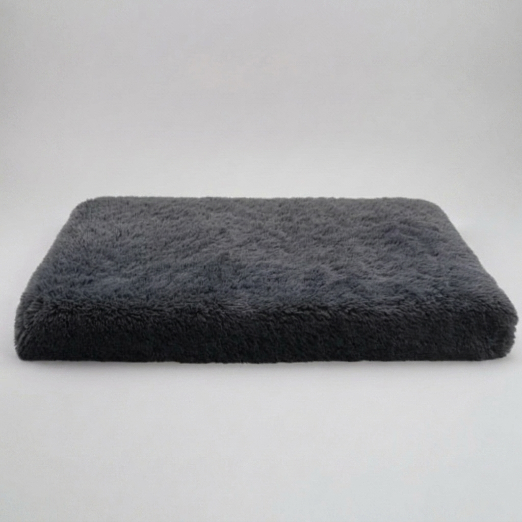 Luxury memory foam dog bed with orthopedic support, providing anti-anxiety calming comfort for pets. Non-slip base.