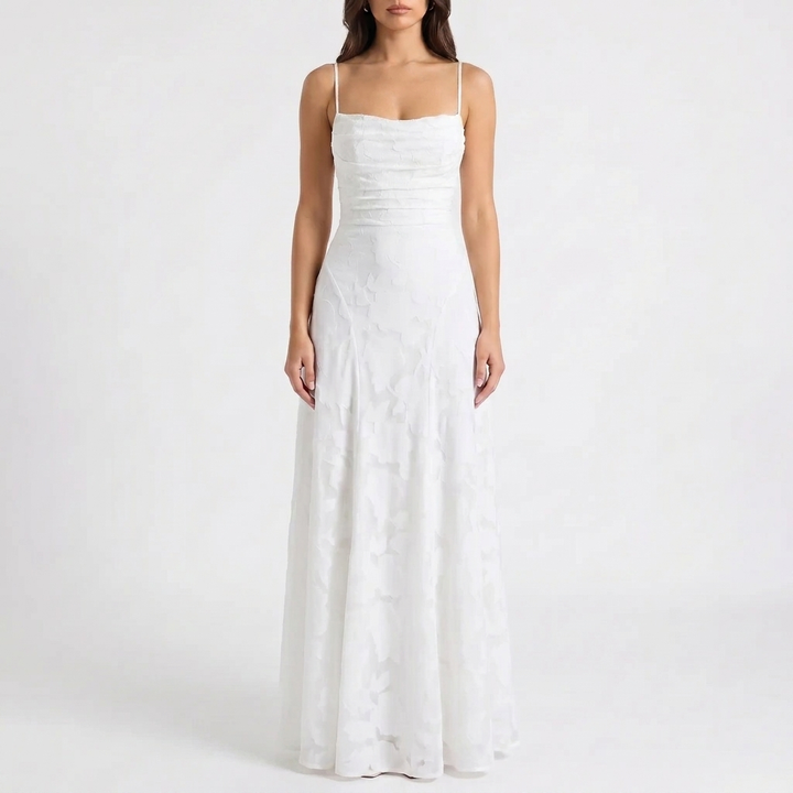 Chic women's floral print maxi evening dress with spaghetti straps, suitable for elegant party wear.