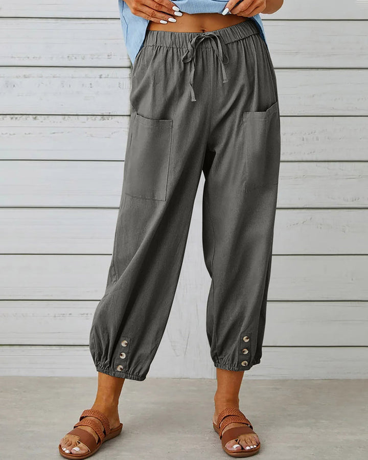 Relaxed fit women's high-waisted wide-leg trousers, offering ultimate comfort and style for everyday wear.