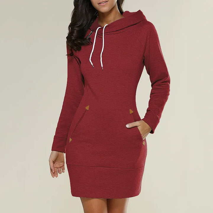 Model wearing women's hooded sweatshirt dress, relaxed fit & useful pockets for comfort.
