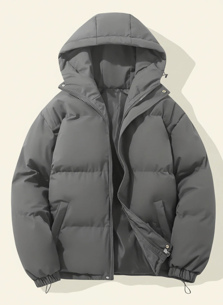 Essential women's hooded puffer winter jacket. Stay warm and stylish in cold weather with this cozy outerwear.