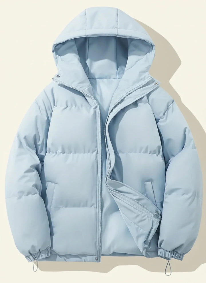Chic women's hooded puffer jacket, a fashionable winter coat. Quilted outerwear for stylish cold weather.