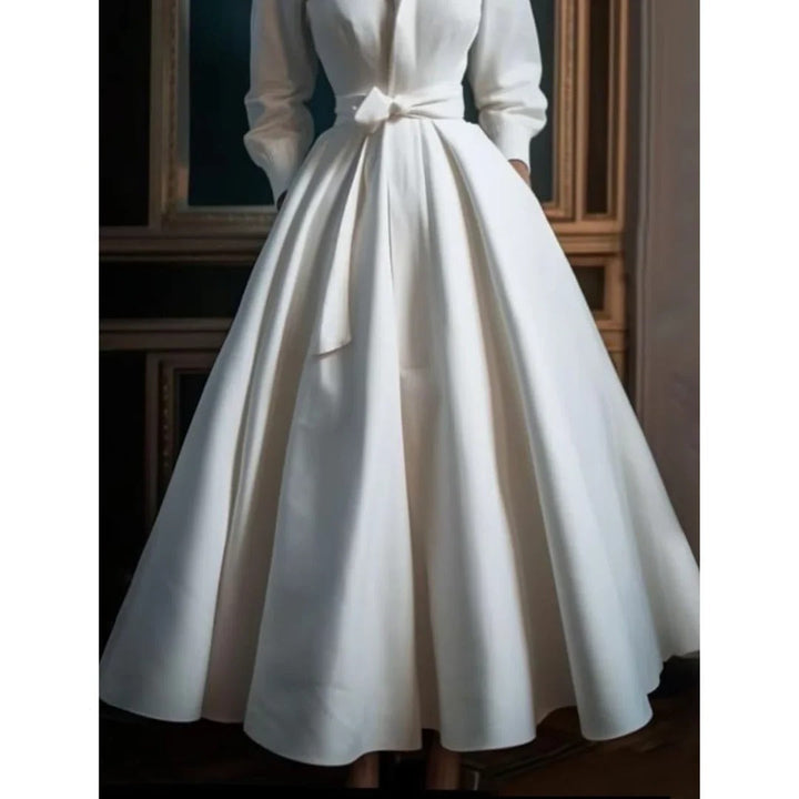 Chic women's white long sleeve V-neck A-line midi dress. A versatile fashion piece for elegant daytime & evening wear.