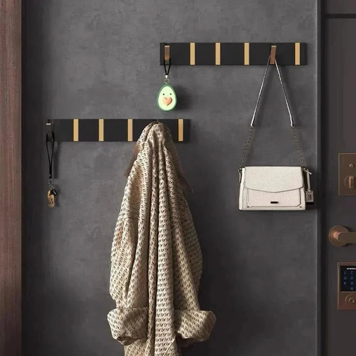 Modern folding wall hook, perfect for entryway coat & bag storage.