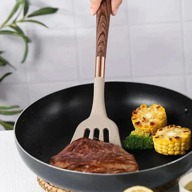 Durable silicone kitchen utensils with natural wood handles; perfect nonstick cooking and baking tools for any kitchen.
