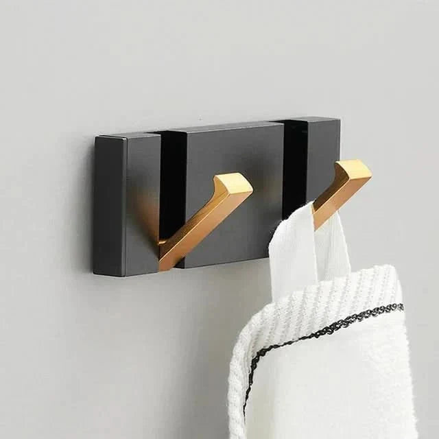 Minimalist folding towel hook for bathroom, kitchen & laundry room organization.