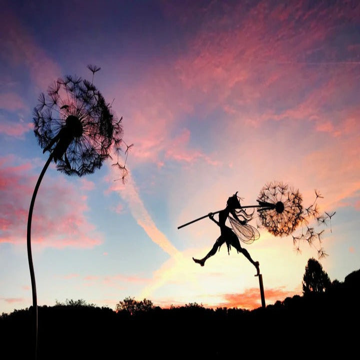Mystical metal fairy garden stake with dandelion design, enhancing outdoor decor & garden aesthetics.