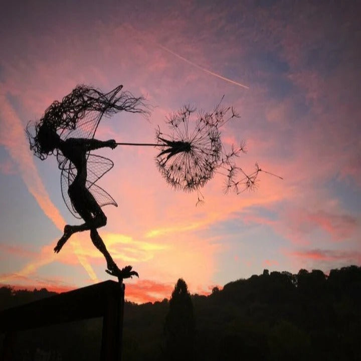 Set of metal fairy & dandelion stakes, whimsical yard art for garden, patio, or landscape decoration.