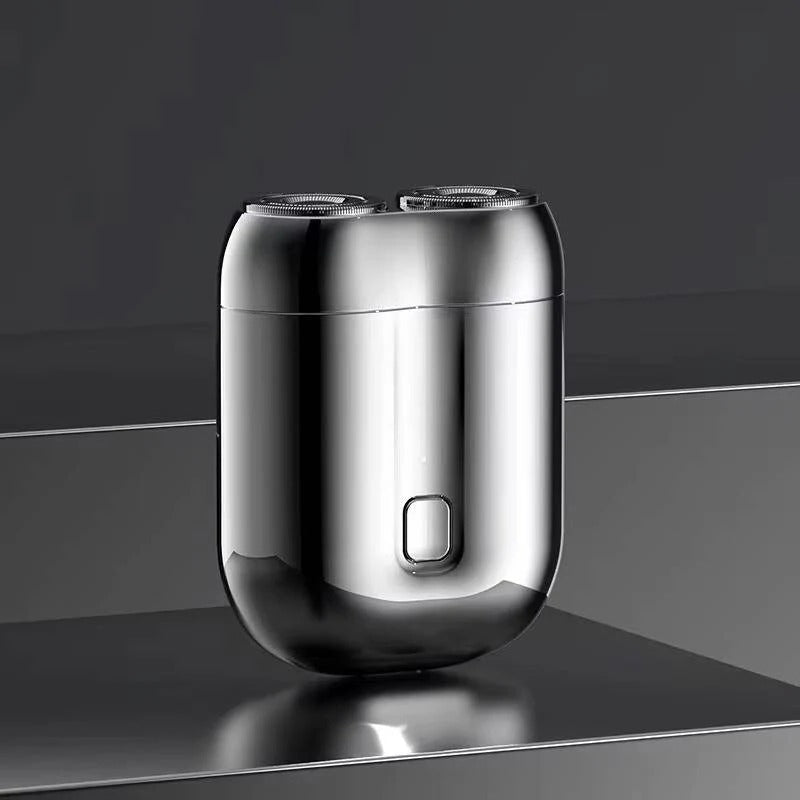Men's portable electric shaver with magnetic charging, ideal for travel. Rechargeable for a smooth, fast shave.