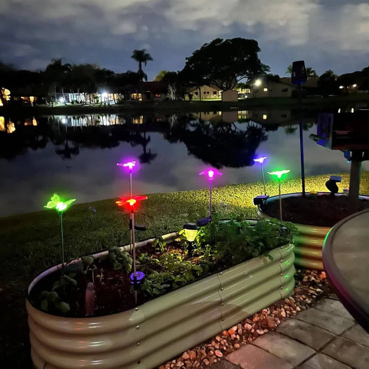 6 pcs solar animal figurine lights illuminate outdoor gardens and pathways with decorative LED glow.