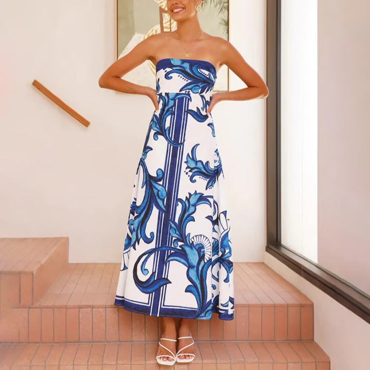 Lightweight women's flowy midi dress with an elegant print & short sleeves, ideal for warm summer fashion.