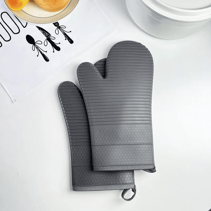 Unisex heat resistant silicone gloves, essential kitchen tools for safe handling of hot items.
