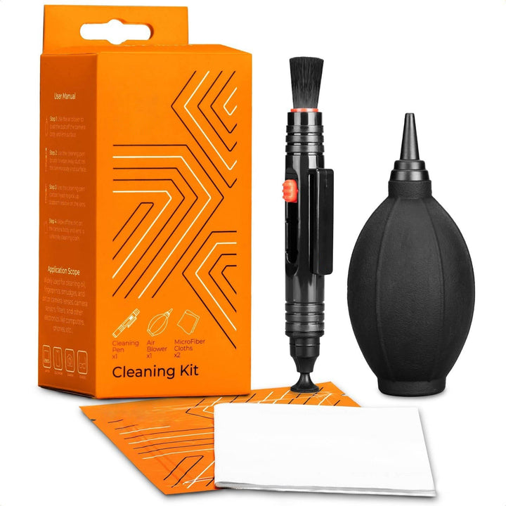 Photographer's portable lens cleaning kit for cameras, includes dust blower, cleaning pen, & cloth.