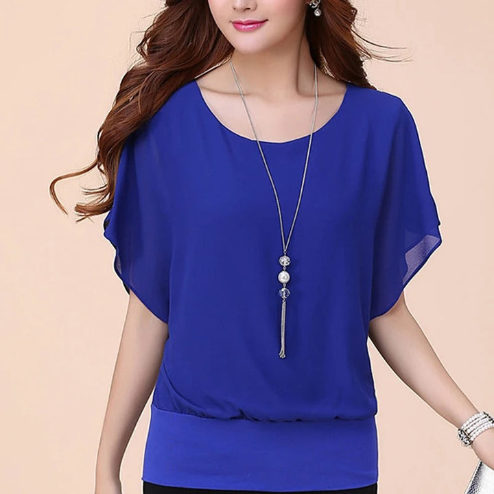 Sophisticated women's ruffled blouse. Batwing sleeves, elegant design, comfortable chiffon.