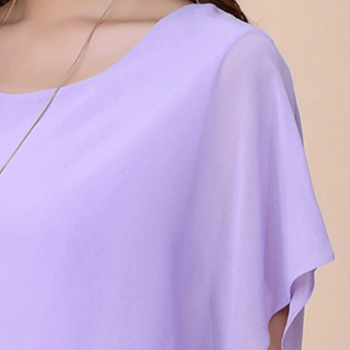 Elegant women's batwing sleeve blouse with delicate ruffles. Casual chic comfort.
