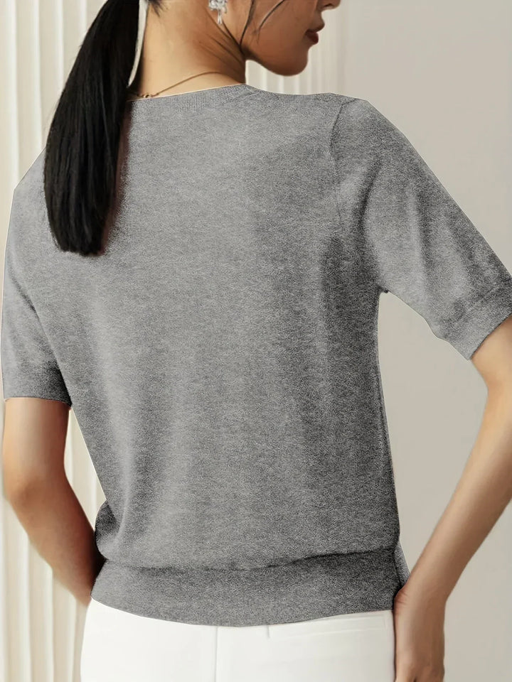 Soft short sleeve sweater for women, a stylish and lightweight spring fashion essential.