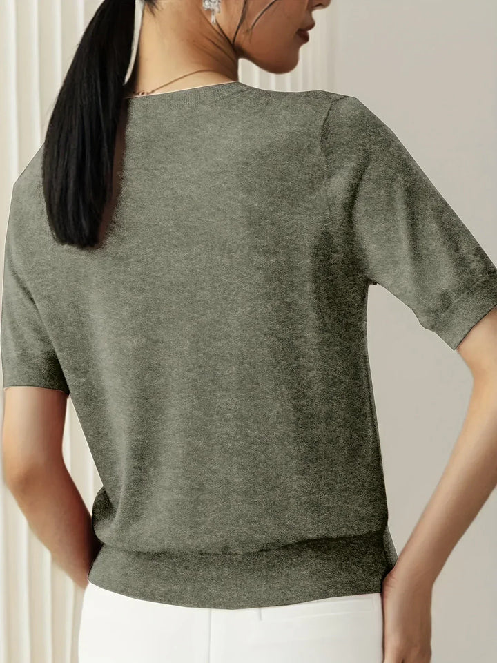 Stylish women's spring sweater, short sleeve knit ideal for warm weather comfort.