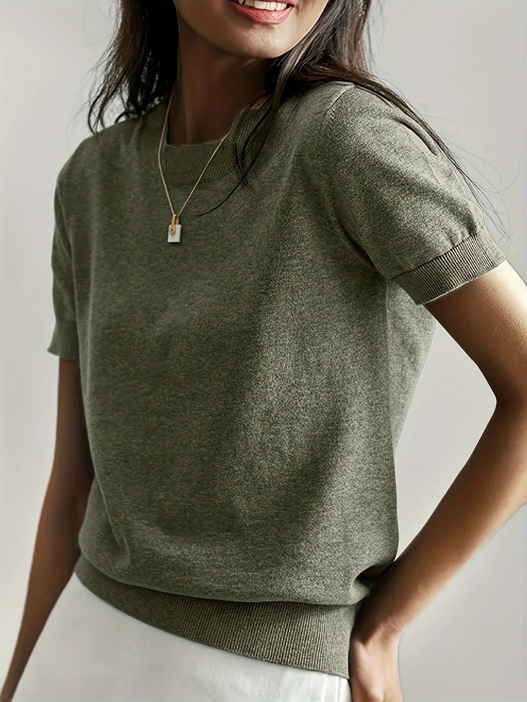 Elegant women's lightweight sweater, short sleeves for comfortable seasonal wear.