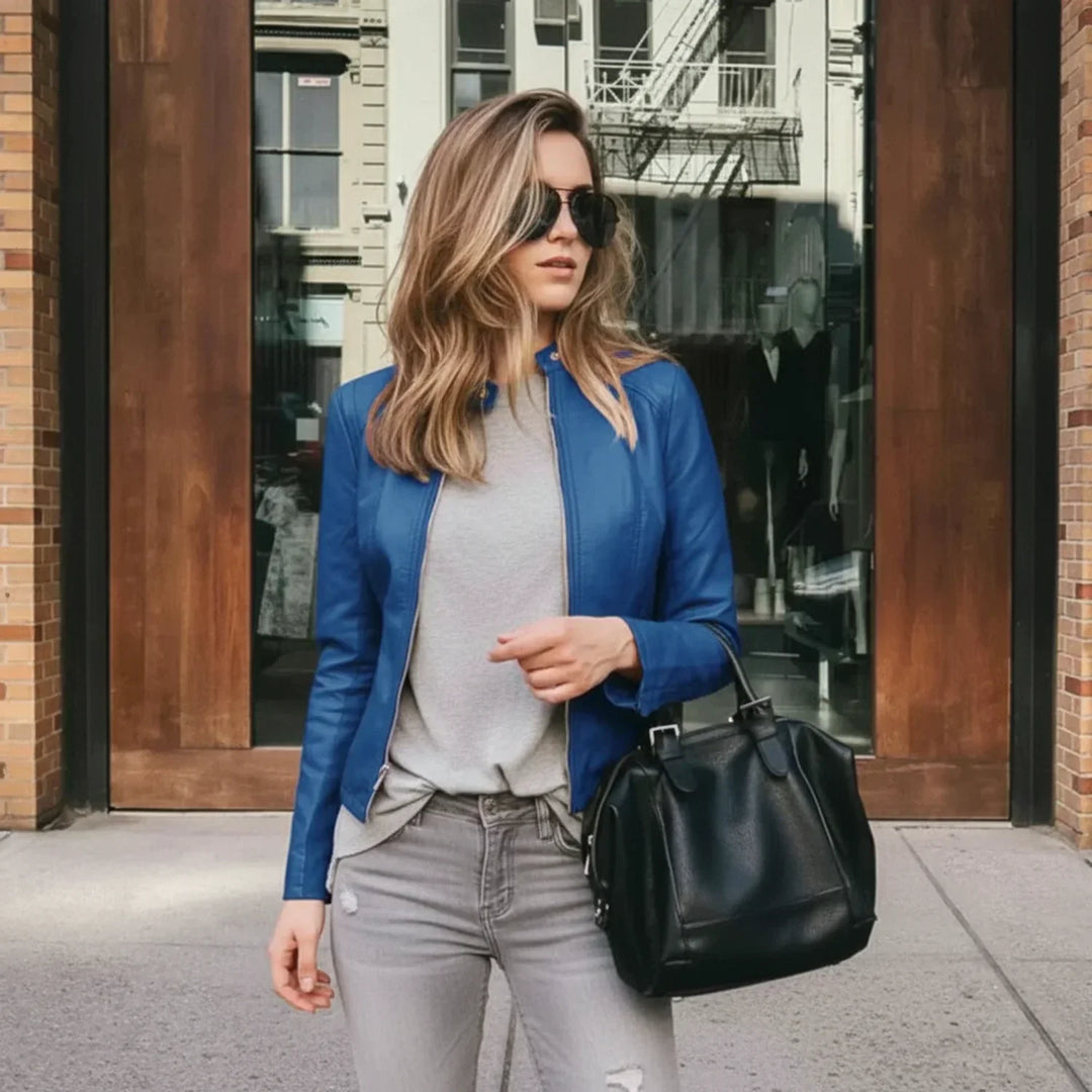 Stylish women's collarless jacket. A chic zip-up design offers a sophisticated and modern outerwear look.