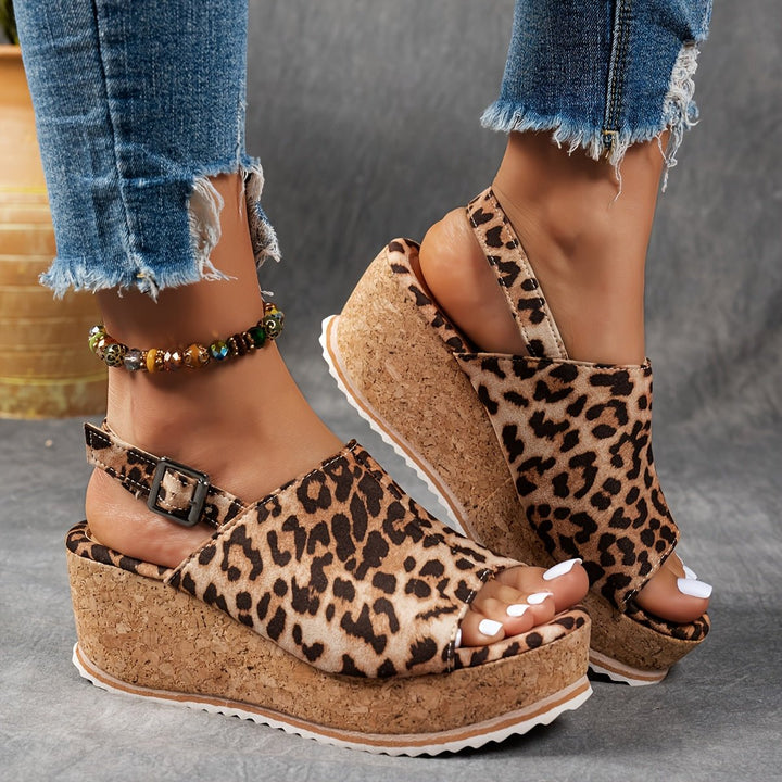 Fashionable leopard print women's platform wedge sandals with adjustable strap, great for casual outfits.