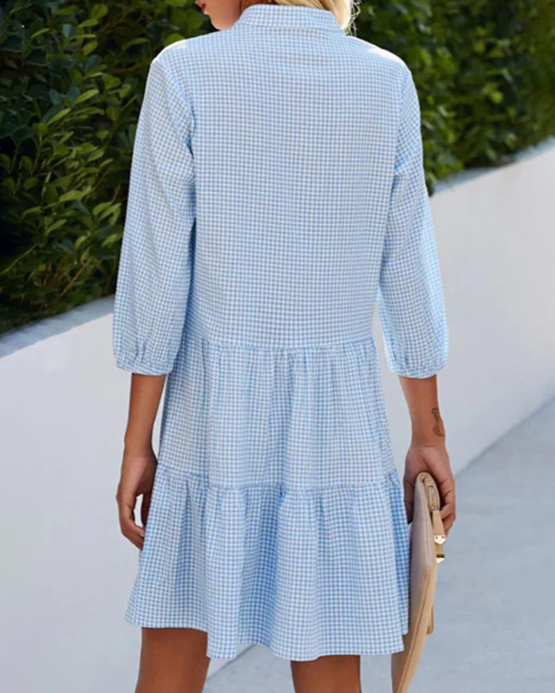 Stylish V-neck A-line summer dress for women. Classic checked pattern, perfect for warm weather.