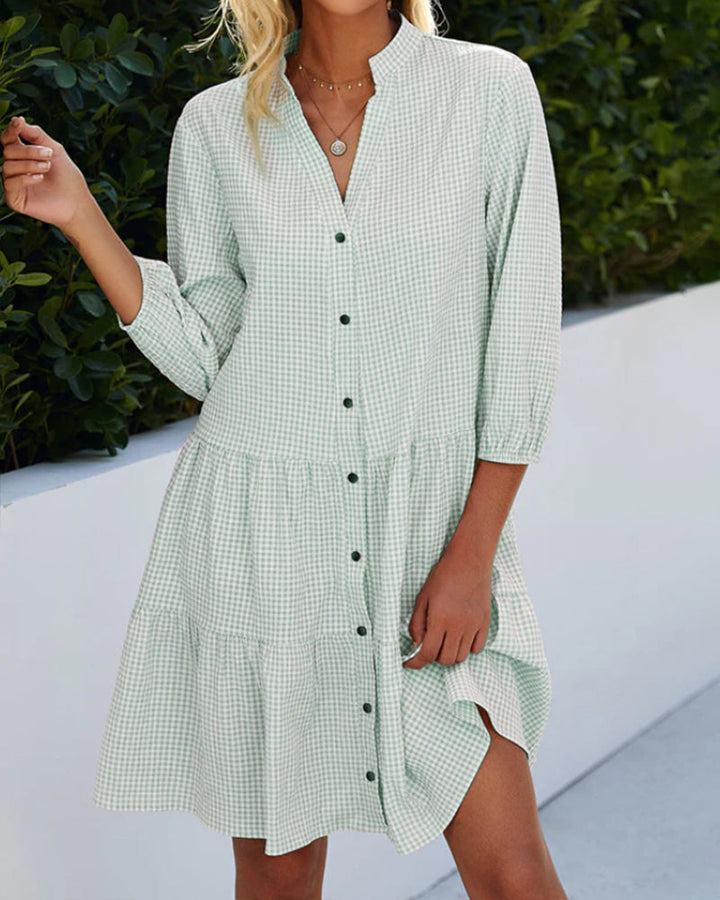 Flattering A-line women's dress with classic checked pattern. Elegant summer style, effortless.