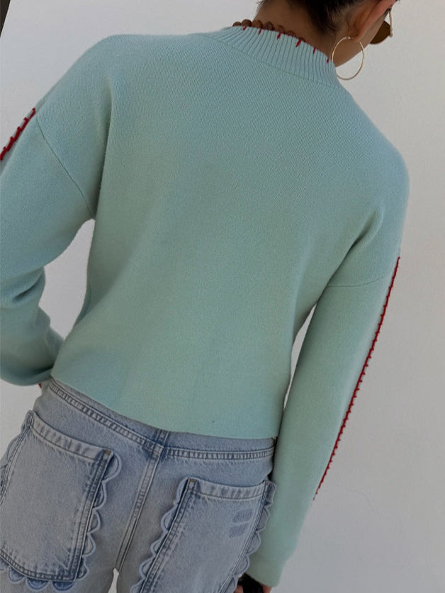 Casual light blue women's long-sleeve knit cardigan featuring a distinctive octopus pattern. Button-front.