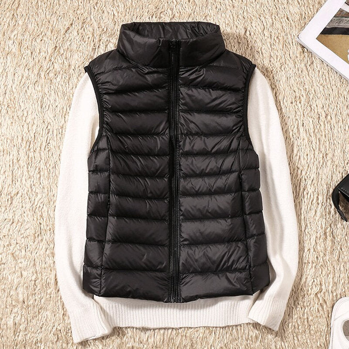Women's lightweight quilted vest in a stylish feminine fit, perfect for fall and spring layering.