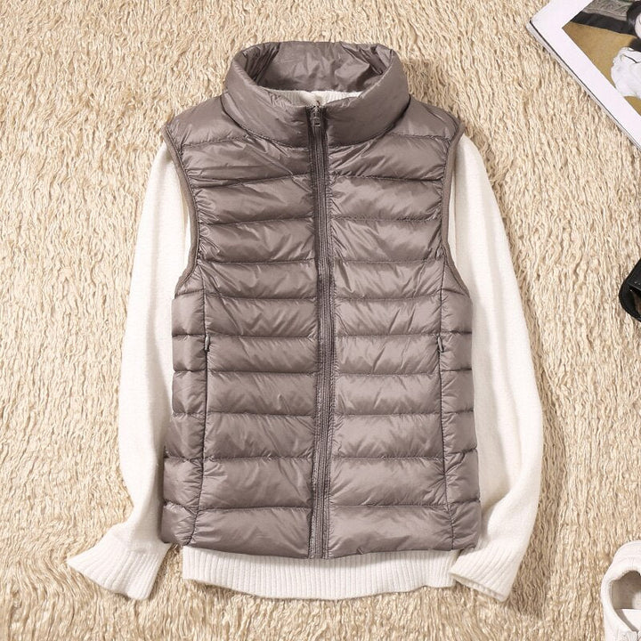 Casual women's quilted sleeveless jacket, offering lightweight warmth and a flattering feminine fit.