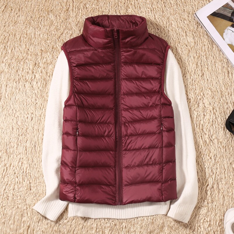 Fashionable women's quilted vest, designed for easy layering and a sleek look in various colors.