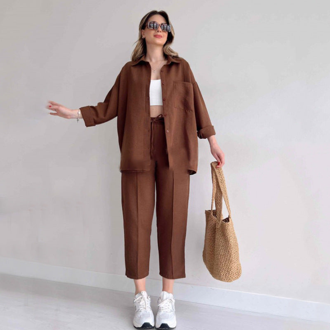 Women's light linen two-piece summer set with wide-leg pants and loose blouse for elegant casual wear.