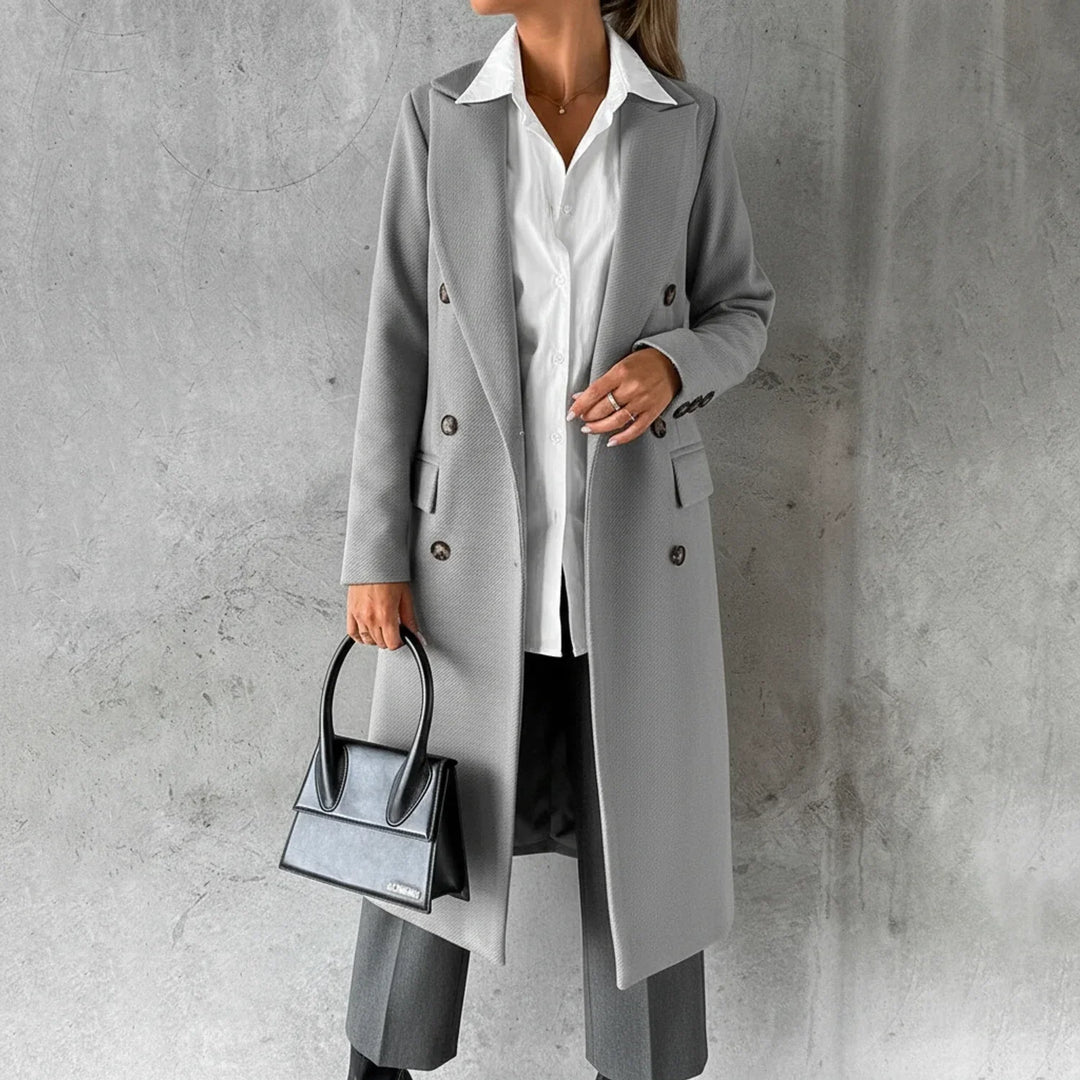 Warm knee-length women's winter coat, double-breasted design for chic and cozy fall outerwear.