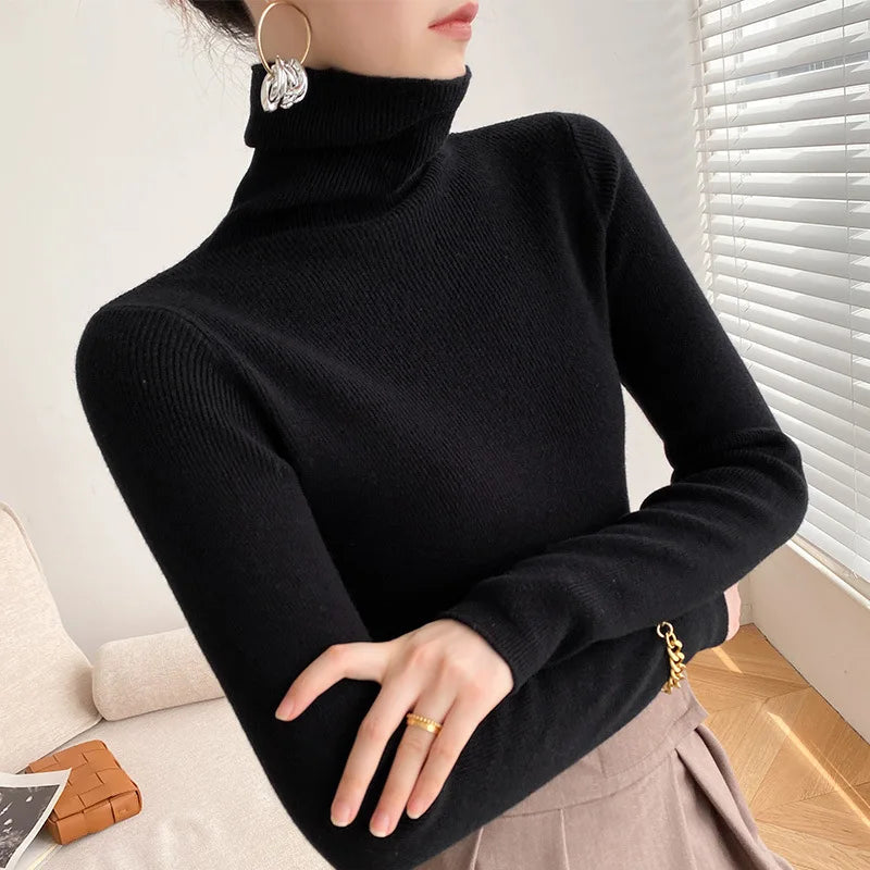 Versatile women's cashmere turtleneck sweater, soft knit, luxurious and elegant for winter layering.