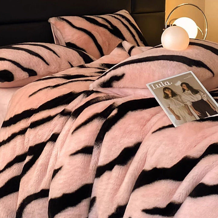 Luxurious zebra print fluffy faux fur bed sheet set. Soft, warm, cozy animal print bedding for king size bedroom decor.