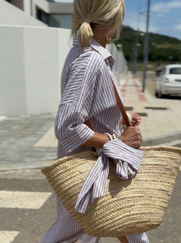Flowy striped button-front midi shirt dress for women, relaxed fit, great for comfortable summer fashion.