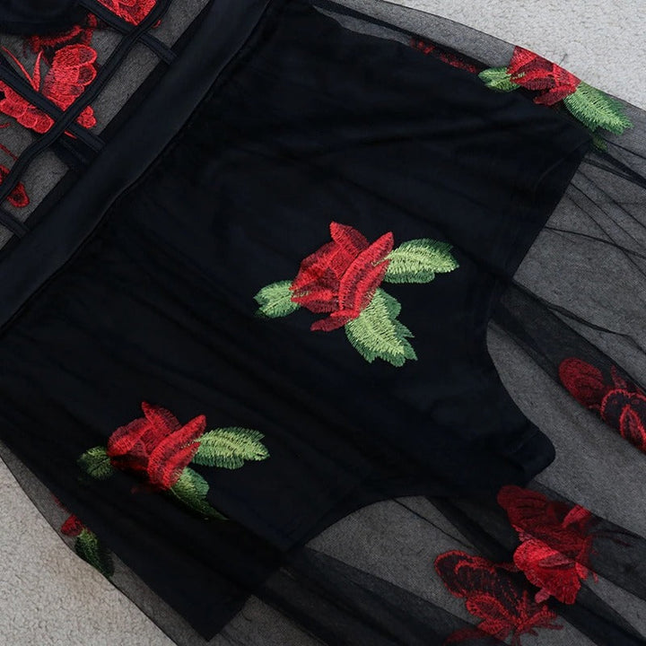 Flowy sleeveless maxi dress with intricate floral embroidery and spaghetti straps, a chic summer vacation dress.