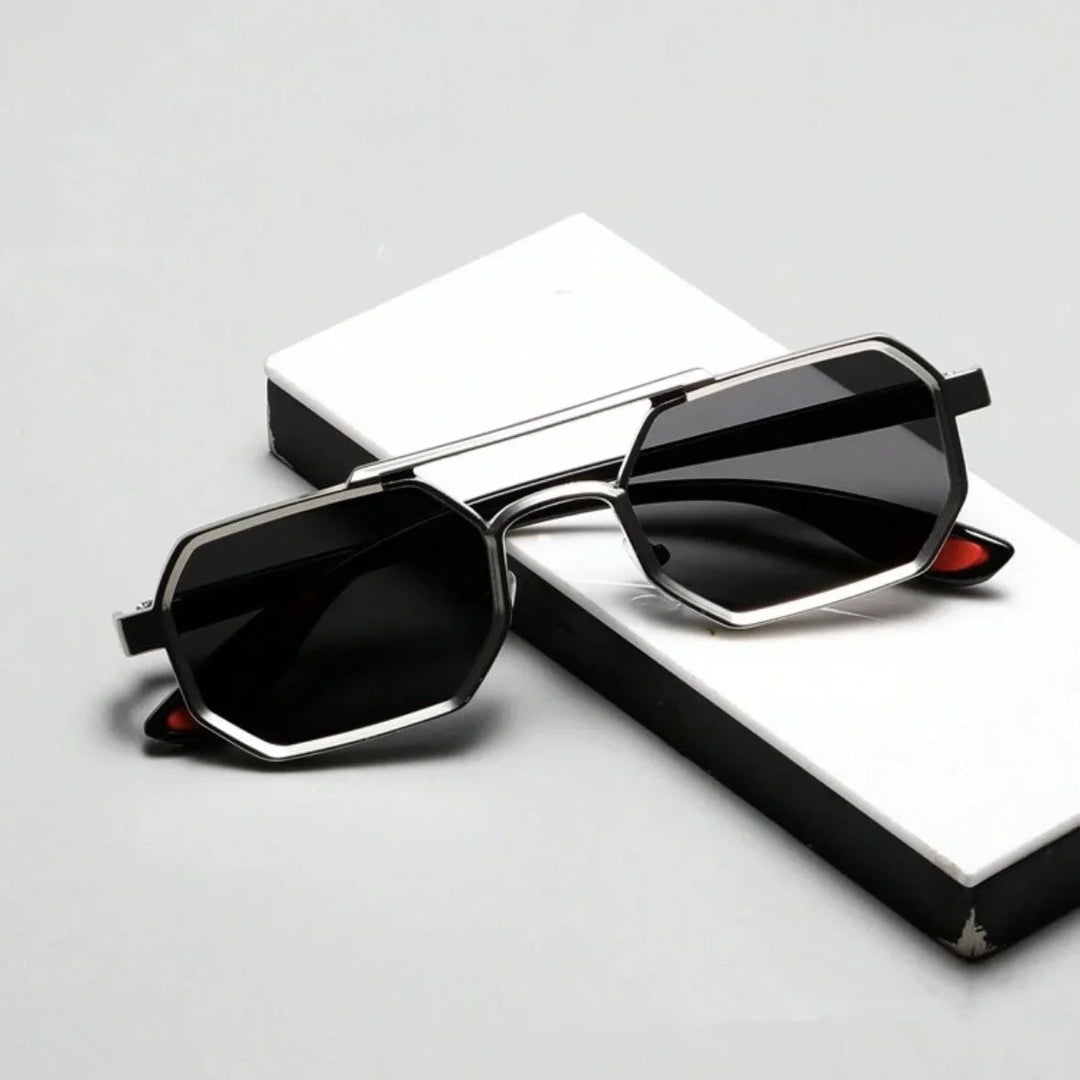 Stylish men's angular sunglasses offering UV protection, a sleek metallic frame, and dark lenses.