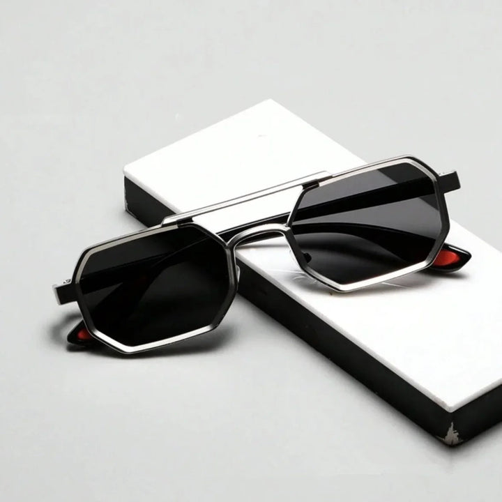 Stylish men's angular sunglasses offering UV protection, a sleek metallic frame, and dark lenses.