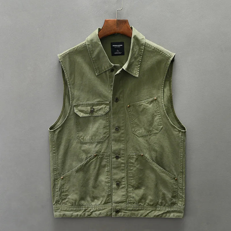 Dark brown men's utility vest, cotton workwear-inspired, featuring multiple pockets, rugged fashion
