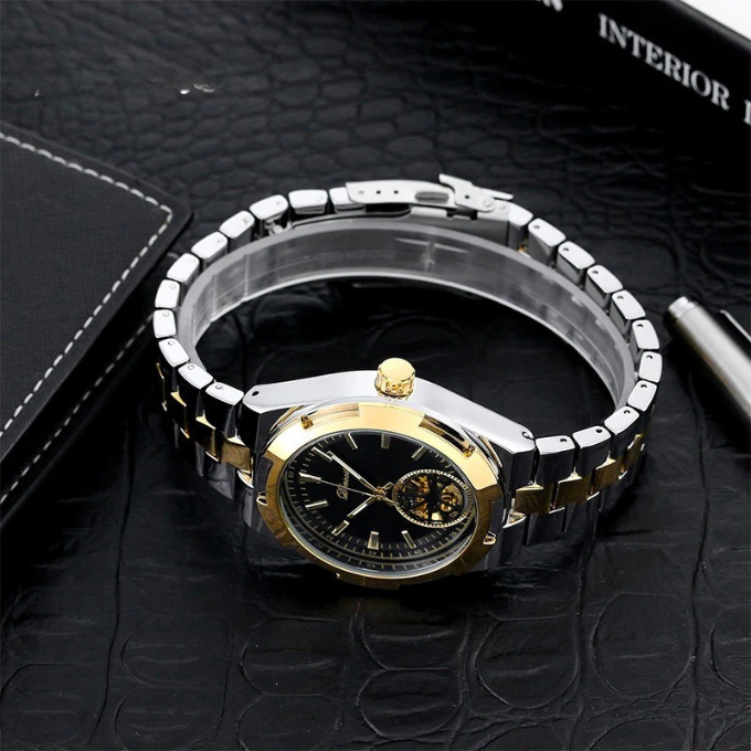 Luxury men's automatic watch with a detailed open-heart skeleton dial, stainless steel band.
