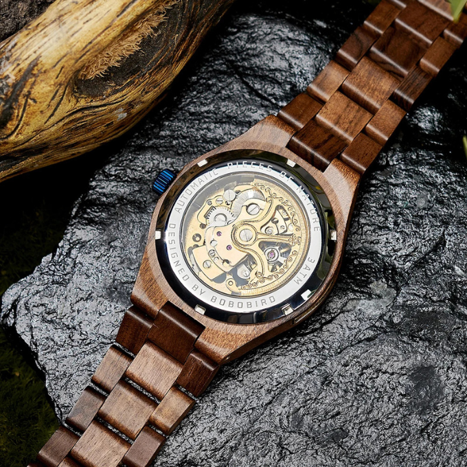 Front view of unique men's automatic watch, featuring a skeleton dial and natural wood bezel.